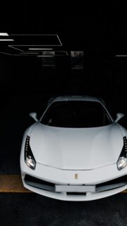 Stunning White Ferrari 488 Supercar in Dark Garage Luxury Wallpaper