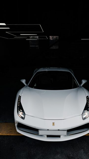 Stunning White Ferrari 488 Supercar in Dark Garage Luxury Wallpaper