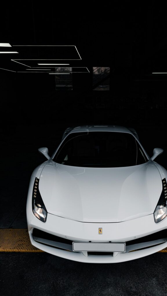Stunning White Ferrari 488 Supercar in Dark Garage Luxury Wallpaper