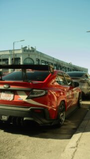 Red Subaru WRX Street Racing Car With Custom Livery Mobile Wallpaper