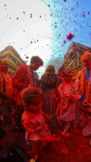 Vibrant Holi Festival Celebration Red Color Cloud Mobile Wallpaper