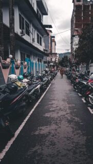 Urban Alley Motorcycle Parking Street Scenery Mobile Wallpaper