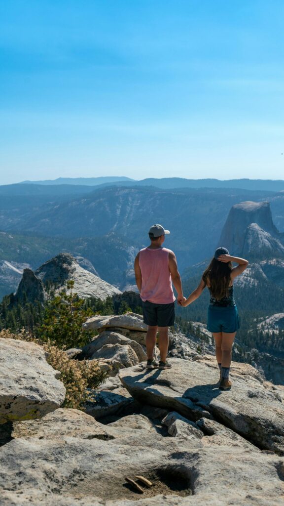 Couple Holding Hands Overlooking Yosemite National Park View Wallpaper