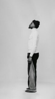 Minimalist Fashion Portrait of Man in White Turtleneck Wallpaper