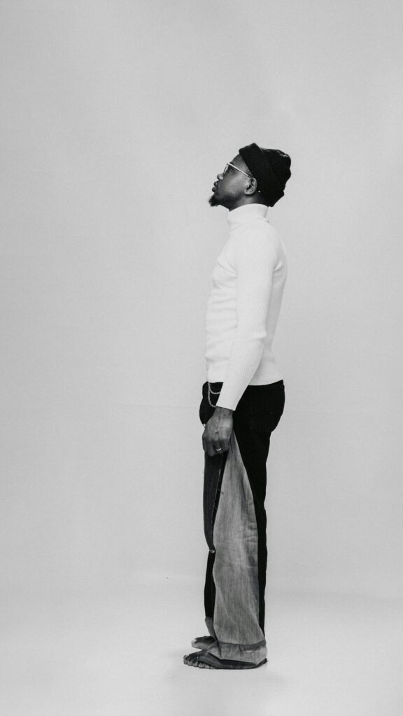 Minimalist Fashion Portrait of Man in White Turtleneck Wallpaper