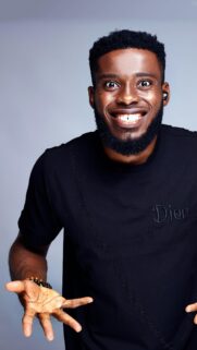 Portrait of a Cheerful Man Wearing a Black Dior T-Shirt Mobile Wallpaper