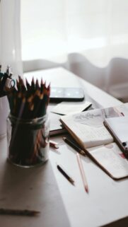 Aesthetic Desk Workspace with Pencils and Notebook Mobile Wallpaper