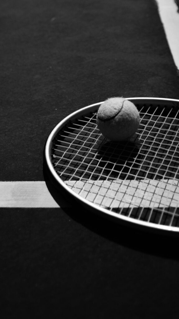 Minimalist Black and White Tennis Racket and Ball Wallpaper
