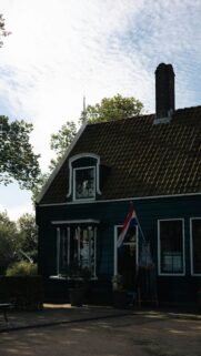 Charming Traditional Dutch Green House Exterior Mobile Wallpaper