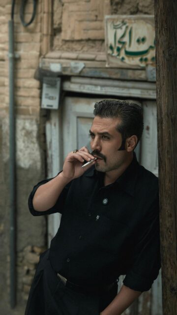 Retro Iranian Man Smoking Noir Style Portrait Phone Wallpaper
