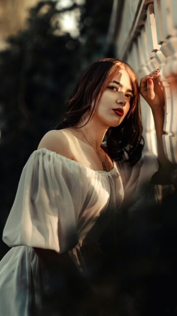 Elegant Woman in White Dress Sunset Portrait Mobile Wallpaper