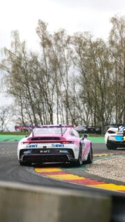 Pink BWT Porsche 911 GT3 Cup Car on Racetrack Mobile Wallpaper