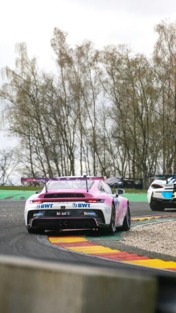 Pink BWT Porsche 911 GT3 Cup Car on Racetrack Mobile Wallpaper