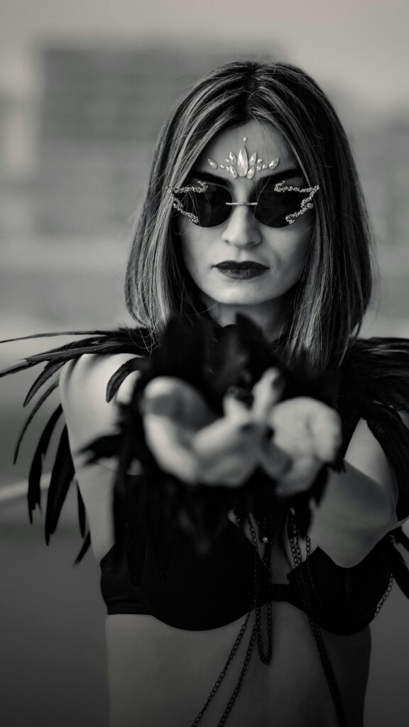 Gothic Raven Queen with Crystal Face Gems and Feather Wings Wallpaper