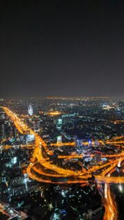 Breathtaking Bangkok Night Cityscape with Illuminated Highway Overpass Wallpaper