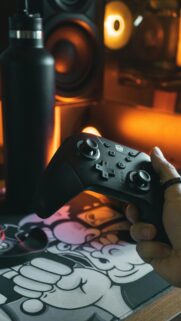 Cinematic Gaming Handheld Controller Setup Mobile Wallpaper