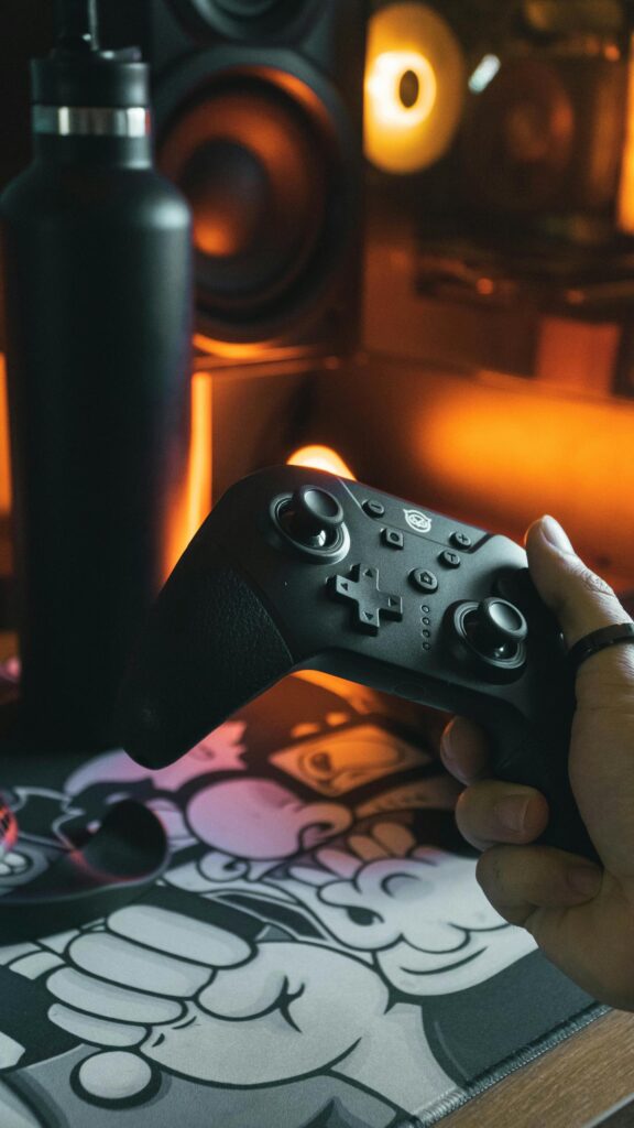 Cinematic Gaming Handheld Controller Setup Mobile Wallpaper