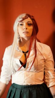 Stunning Cosplay Girl with Split-Color Hair Portrait Wallpaper