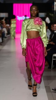 Stunning Fashion Model Runaway Walk in Satin Lime and Pink Outfit Wallpaper