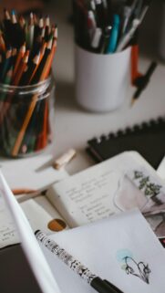 Cozy Artist Desk with Colored Pencils and Journal Aesthetic Wallpaper