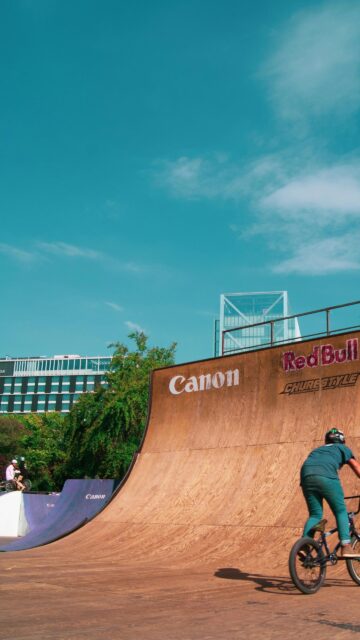 BMX Rider on Wooden Skate Ramp Action Mobile Phone Wallpaper