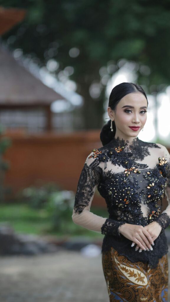 Elegant Indonesian Woman in Traditional Kebaya Phone Wallpaper