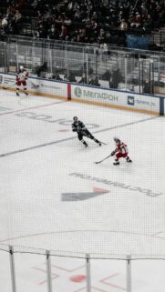 Professional Ice Hockey Game Action Shot Mobile Wallpaper
