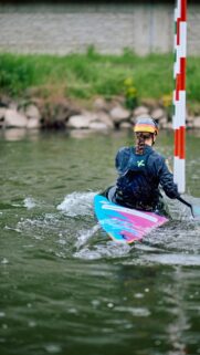 German Canoe Slalom Athlete Paddling Through Gates Mobile Wallpaper