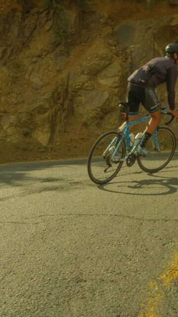 Cyclist Cycling on Mountain Road Sport Mobile Wallpaper