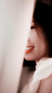 Beautiful Asian Girl Smiling Behind White Fabric Portrait Wallpaper