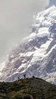 Hikers Beneath Mount Cook Glacial Peaks Mobile Wallpaper