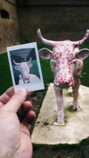 Artistic Cow Statue with Floral Pattern Photography Mobile Wallpaper