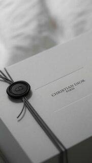 Elegant Christian Dior Gift Box with Black Wax Seal Wallpaper