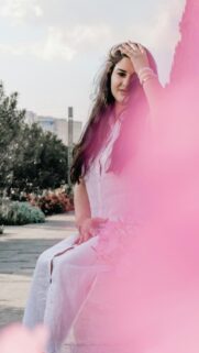 Beautiful Woman in White Linen Dress with Soft Pink Filter Wallpaper