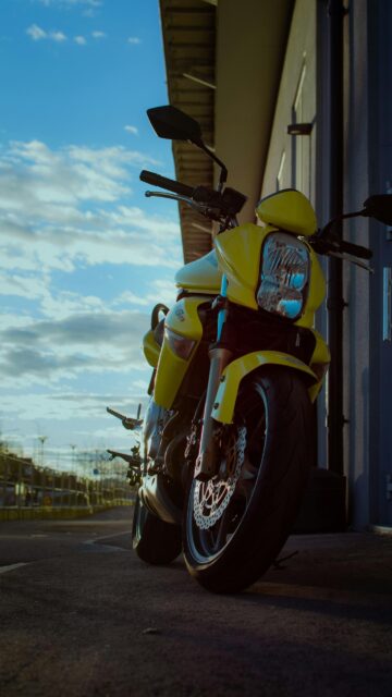 Stunning Yellow Sports Motorcycle Low Angle Sunset Mobile Wallpaper
