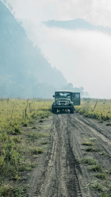 Rugged Off-Road Toyota Land Cruiser in Misty Bromo Mountains Wallpaper