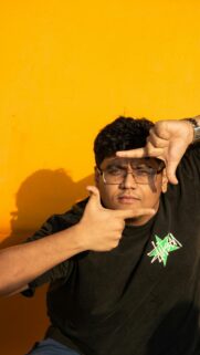 Young Man Framing Face Gesture Yellow Background Mobile Wallpaper
