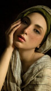 Portrait of a Woman with Freckles and Headscarf Mobile Wallpaper
