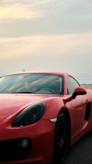 Stunning Red Porsche Cayman Sports Car Mobile Wallpaper