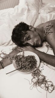 Young Man with Spaghetti and Glitter Surreal Artistic Phone Wallpaper