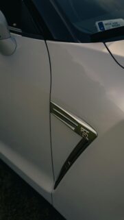 Nissan GT-R Fender Emblem Close-up White Sports Car Wallpaper