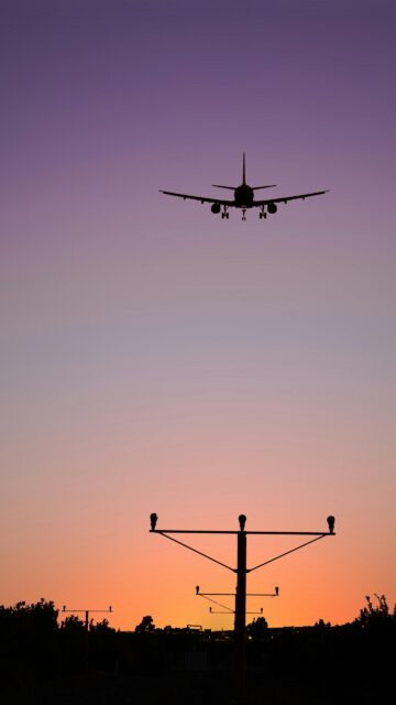 Stunning Airplane Sunset Landing Silhouette Mobile Wallpaper