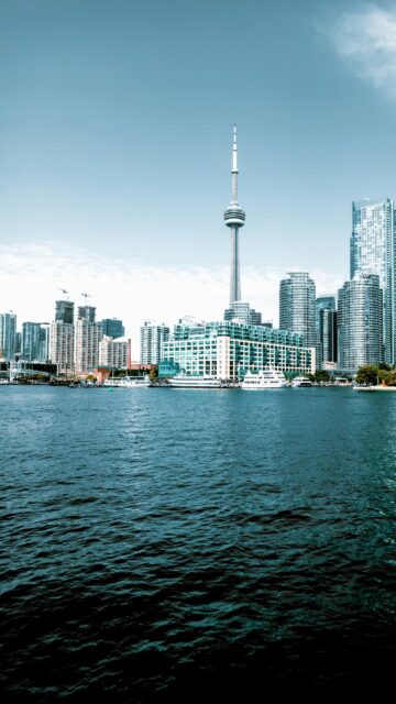 Stunning Toronto Skyline and CN Tower over Lake Ontario Mobile Wallpaper