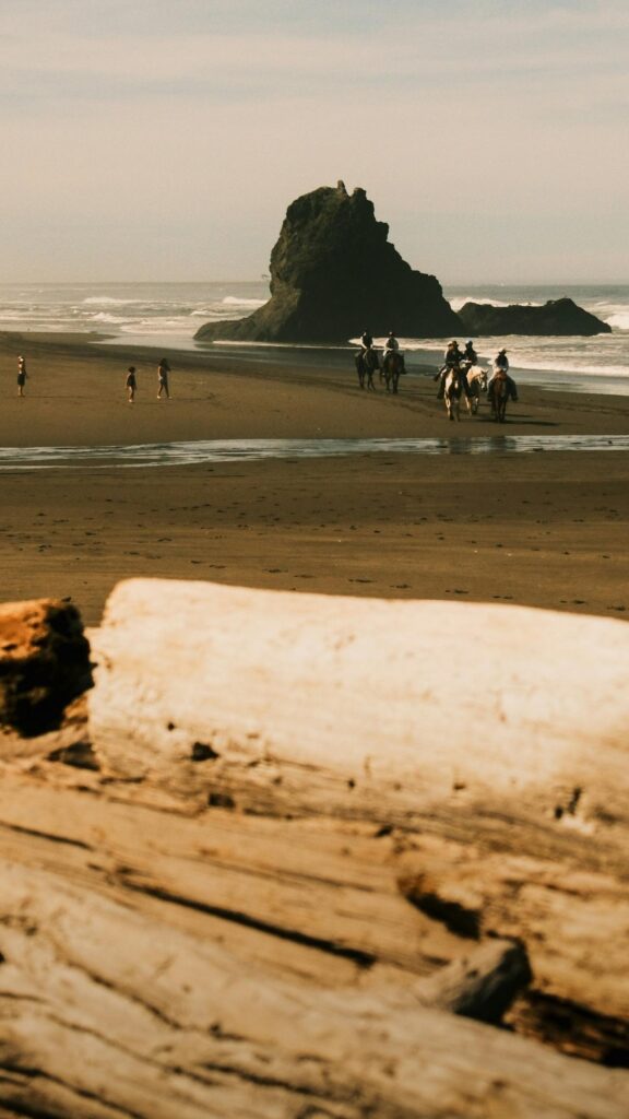 Horseback Riding on Misty Oregon Coast Beach Scenic Mobile Wallpaper