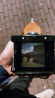 Vintage Film Camera Viewfinder Capturing A Sunny Day Street Scene Wallpaper