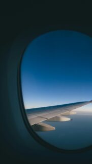 Serene Airplane Wing Above the Clouds Mobile Wallpaper