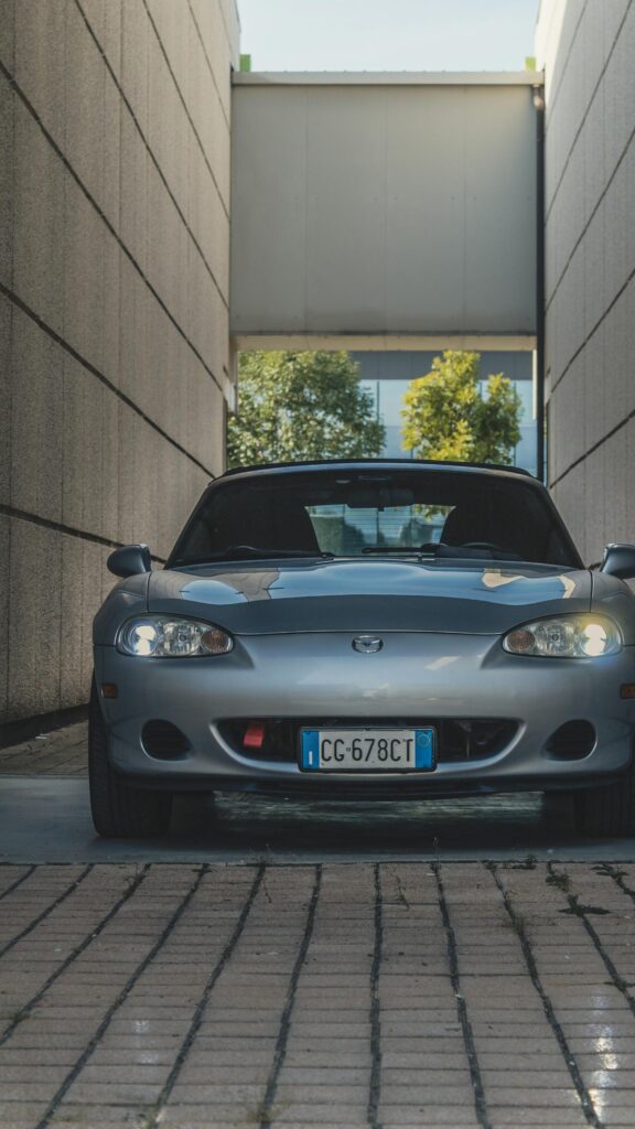 Silver Mazda Miata NB Sports Car Parked Between Walls Wallpaper