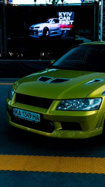Neon Yellow Mitsubishi Lancer Evolution Sports Car Mobile Wallpaper