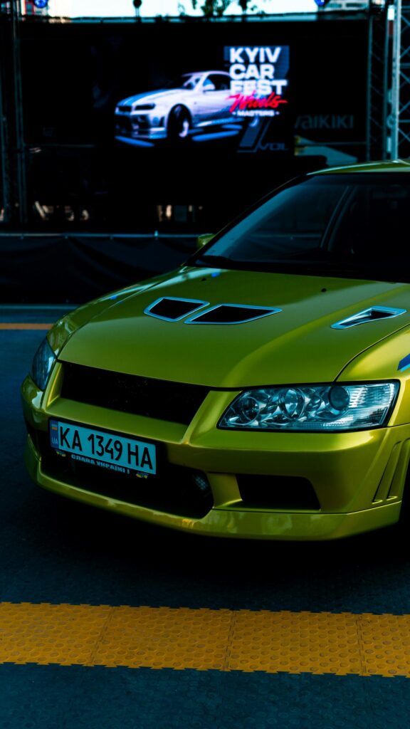 Neon Yellow Mitsubishi Lancer Evolution Sports Car Mobile Wallpaper