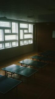 Minimalist Table Tennis Room with Dramatic Sunlight Mobile Wallpaper